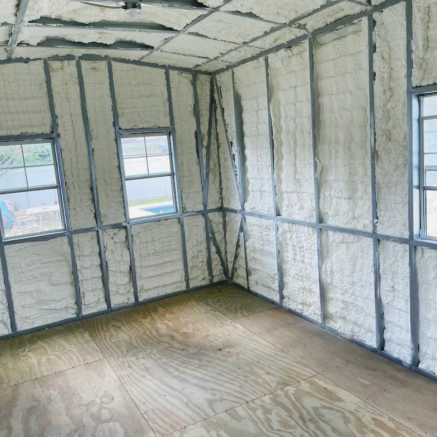Closed-cell spray foam insulation applied to wall cavities in a residential project in Lake Mills